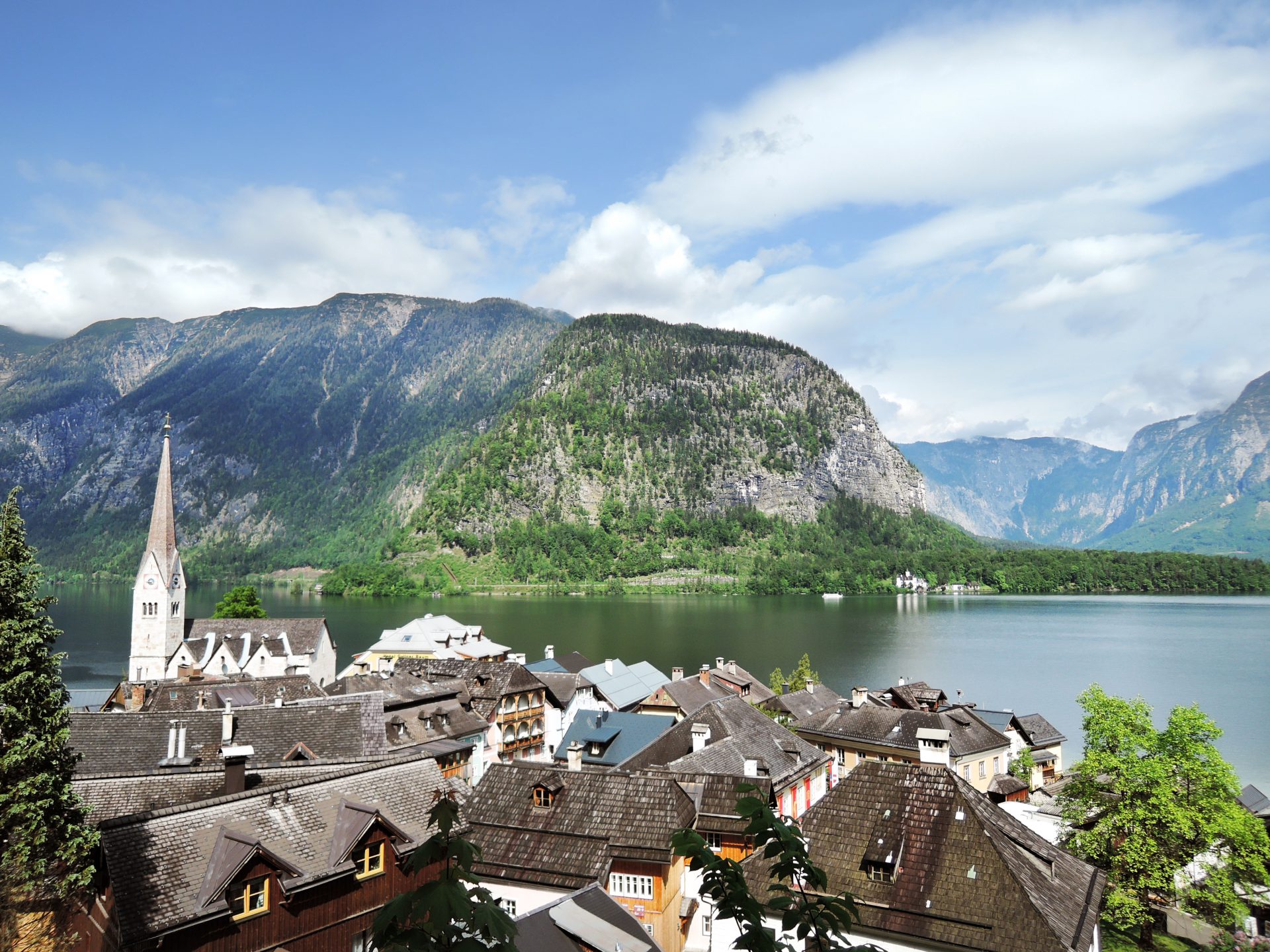 Go encounter photo of houses, a lake, and large mountains