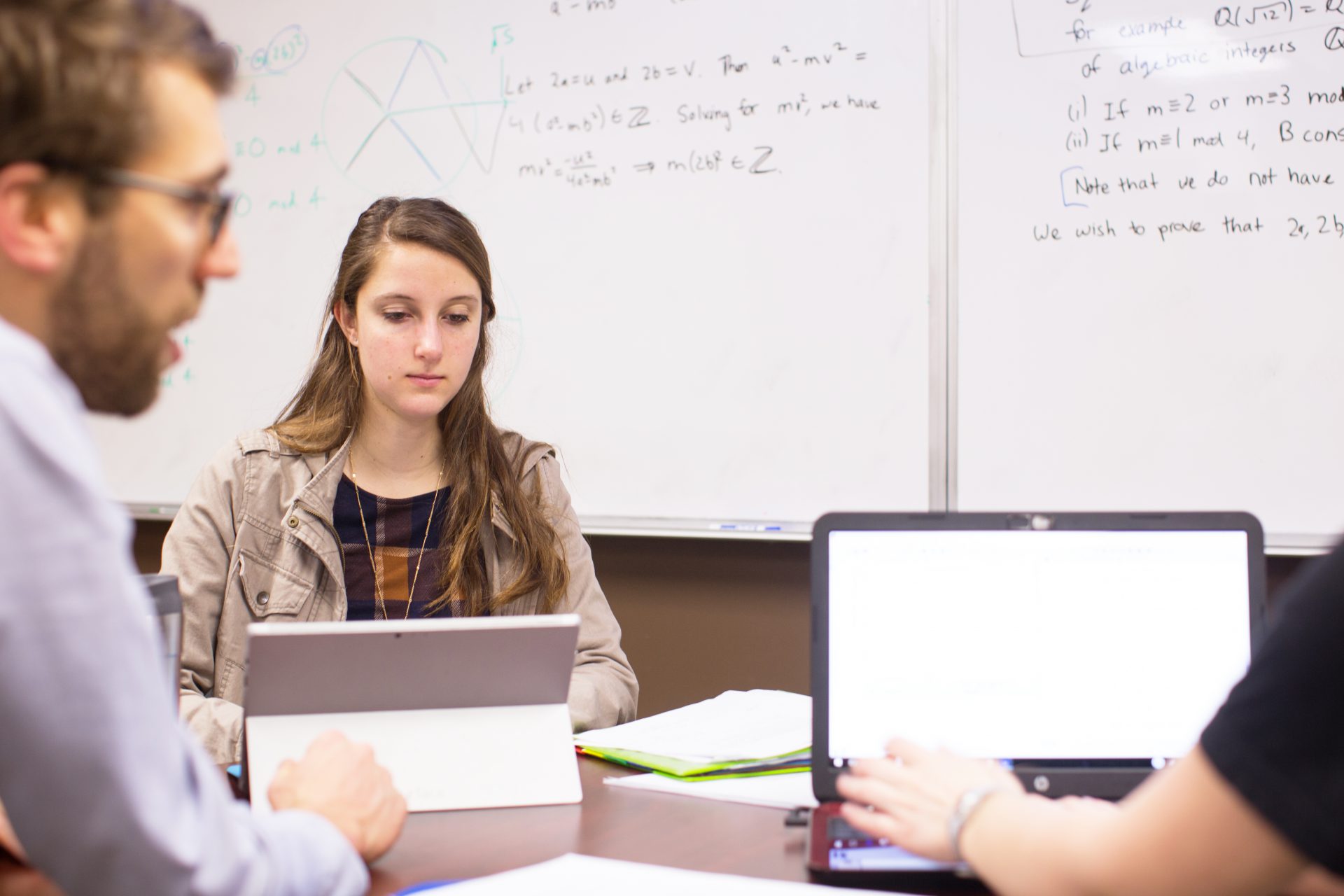 College Mathematics Student in class working on laptop