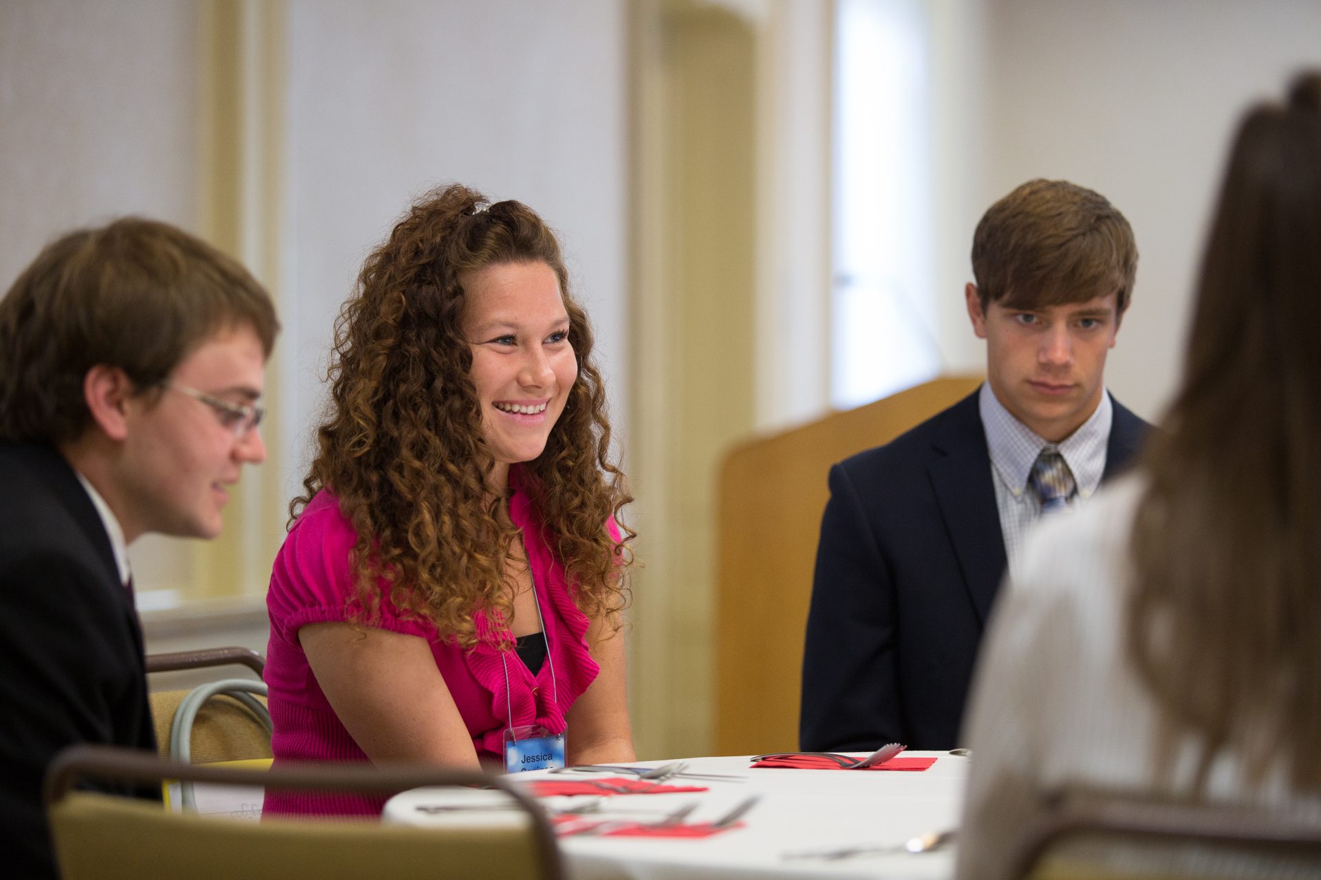 Students at accounting job fair sitting at table