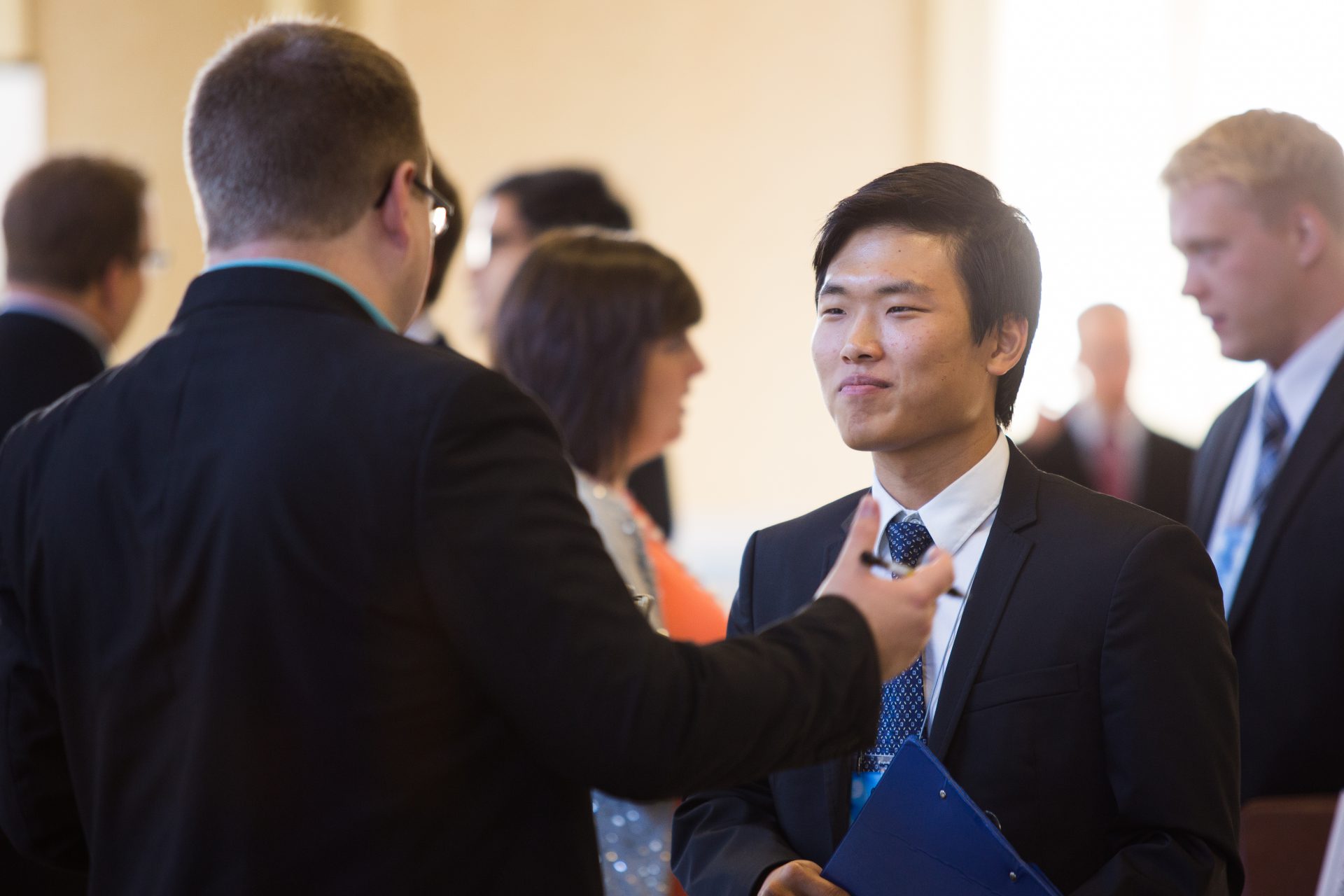 Business students in job fair presentations