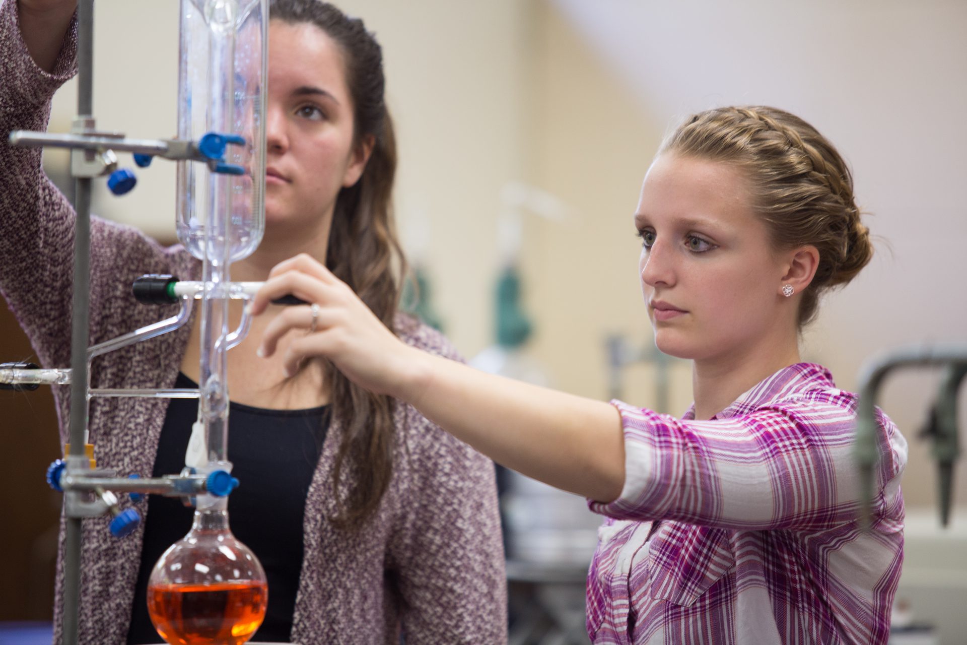 Chemistry degree Students in lab with test tubes